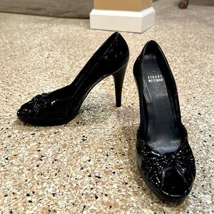 Stuart Weitzman black patent leather peep toe pumps. 4 inch heels.